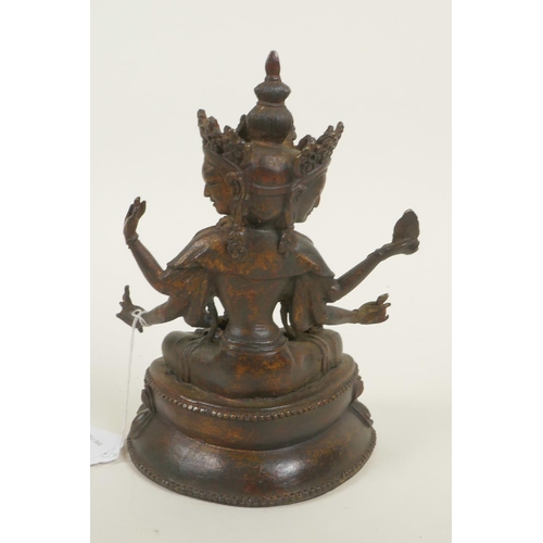 379 - A bronze Buddhistic figure with eight arms, seated upon a lotus throne, pendant 2