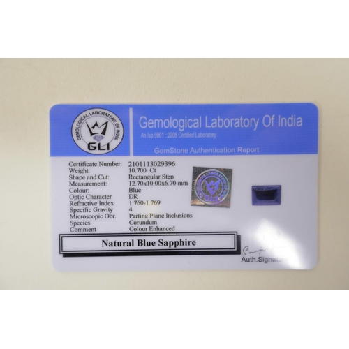 718 - A 10.70ct natural blue sapphire, rectangular step cut, colour enhanced, certified by Gemological Lab... 