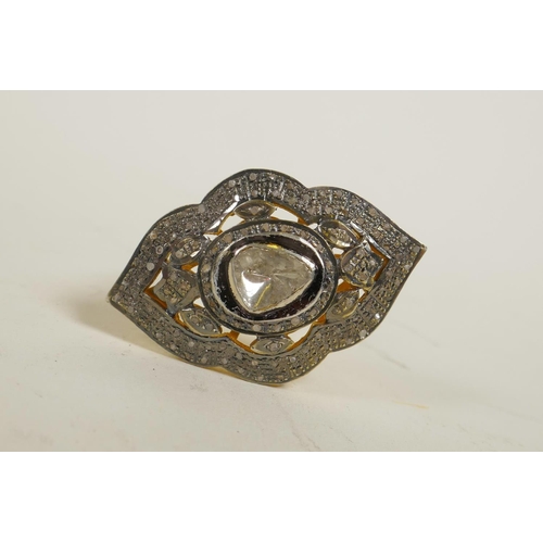 725 - A silver gilt dress ring of diamond form, set with uncut diamonds