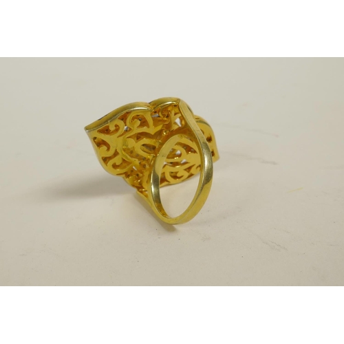 725 - A silver gilt dress ring of diamond form, set with uncut diamonds