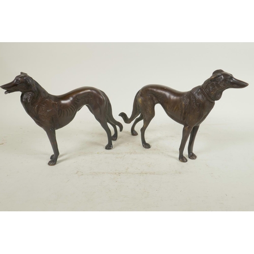 1 - A pair of well cast bronze figures of hounds, 6½