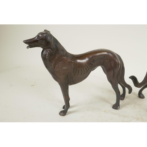 1 - A pair of well cast bronze figures of hounds, 6½