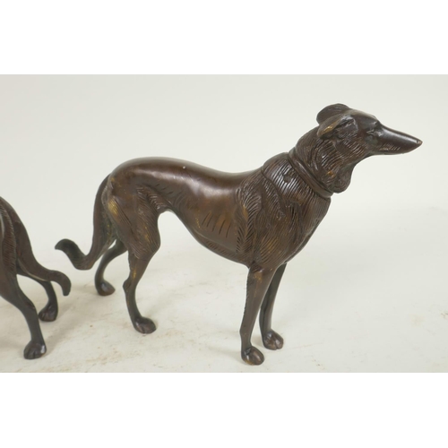 1 - A pair of well cast bronze figures of hounds, 6½