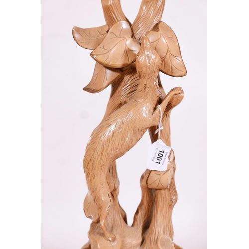 1001 - A carved and pierced wood jardiniere stand, modelled as a weasel chasing a mouse in a vine, gessoed ... 