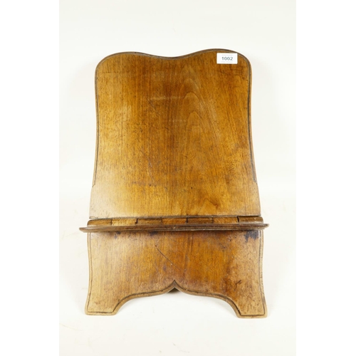 1002 - A Georgian mahogany folding bookstand made from a single piece of timber, 18½