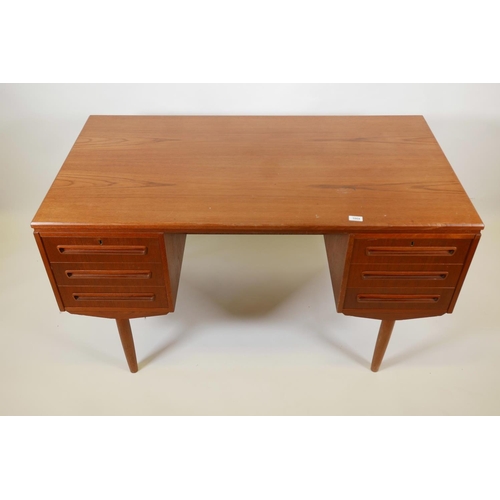 1004 - A Danish 1960s teak two sided desk designed by J. Svenstrup for A.P. Møbler, with six drawers to one... 