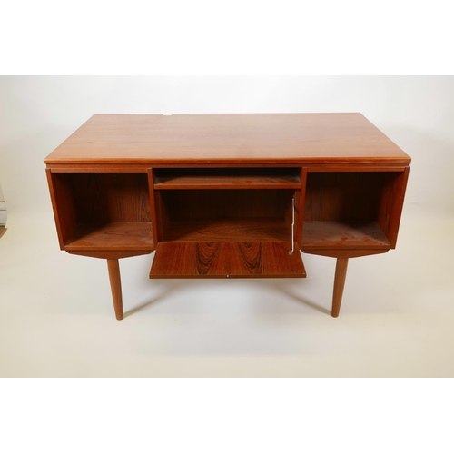 1004 - A Danish 1960s teak two sided desk designed by J. Svenstrup for A.P. Møbler, with six drawers to one... 