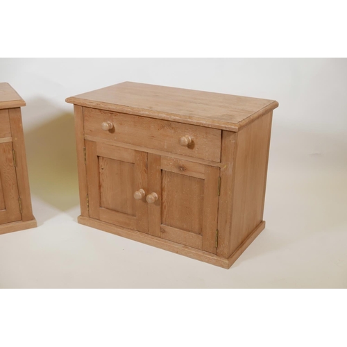 1007 - A pair of pine two door bedside cabinets with a single drawer, 27