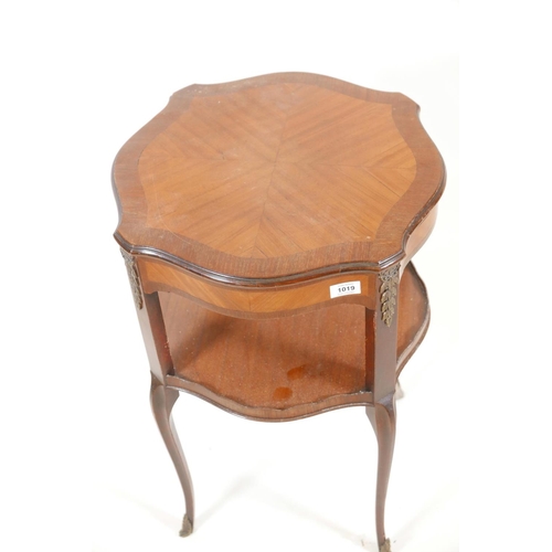 1019 - A French style mahogany two tier occasional table, with a satinwood painted top and shaped gallery t... 