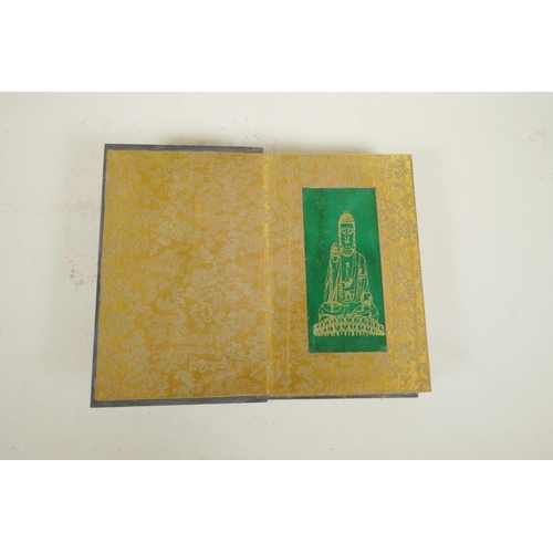 102 - A Chinese wood and material bound book containing jade tablets with engraved and gilt character insc... 