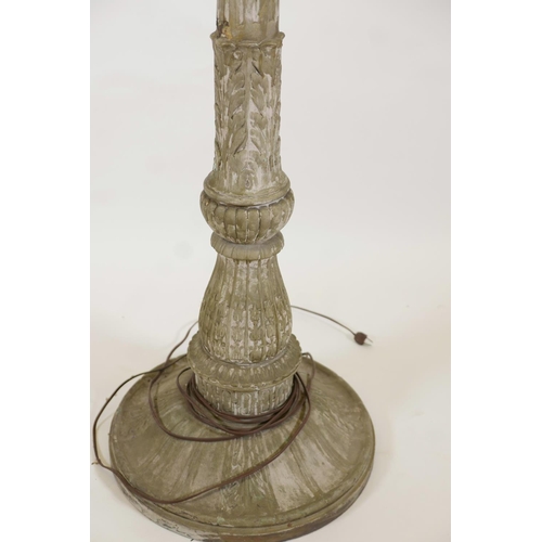 1023 - A metal and plaster standard lamp painted over what appears to be a copper and brass metal sheath, e... 