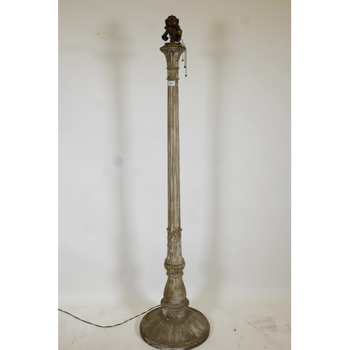 1023 - A metal and plaster standard lamp painted over what appears to be a copper and brass metal sheath, e... 