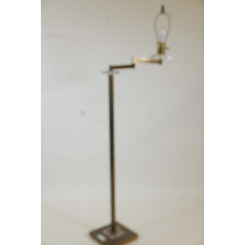 1024 - A brass and lucite standard lamp with cantilever arm