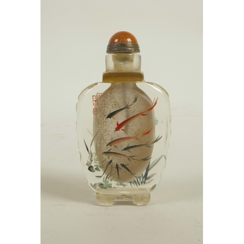 103 - A Chinese enamelled glass snuff bottle decorated with red and black carp, 4 character mark to base, ... 