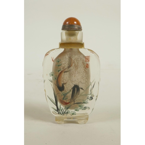 103 - A Chinese enamelled glass snuff bottle decorated with red and black carp, 4 character mark to base, ... 