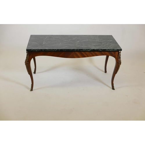 1031 - A mahogany coffee table with an adapted vert de mer style top and gilt metal mounts, 35