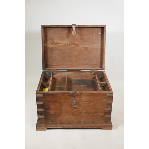 1060 - An Indian teak blanket box with brass mounts and shaped plinth base, 27