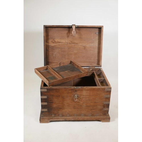 1060 - An Indian teak blanket box with brass mounts and shaped plinth base, 27