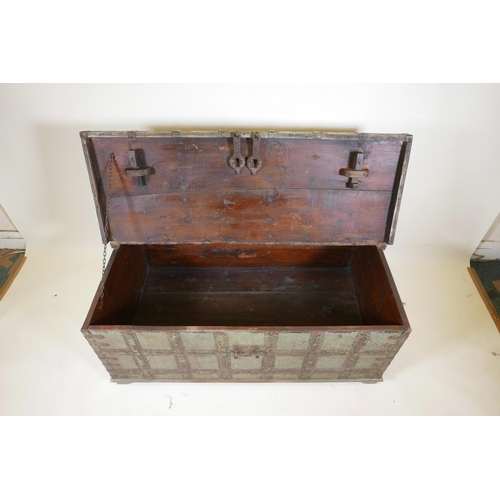 1061 - An Indian teak chest with iron strapwork and hinged fold over top, and traces of original paint, 49