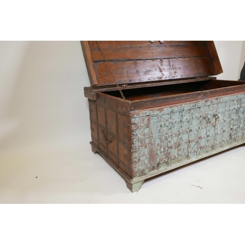 1062 - An Indian teak dowry chest with iron strap work wand hinged fold over top, with original distressed ... 