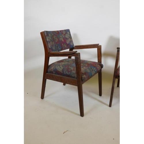 1074 - A pair of mid century teak open armchairs, possibly American