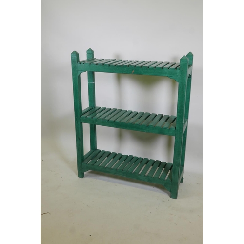 1075 - An Indian painted hardwood three tier open rack, 3