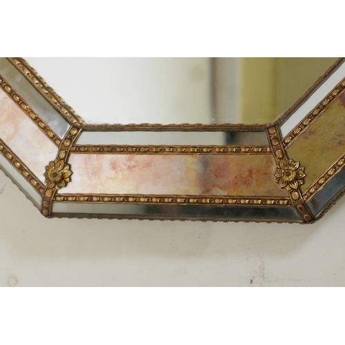 1082 - A brass mounted cushion wall mirror, with antiqued glass, late C20th, 31