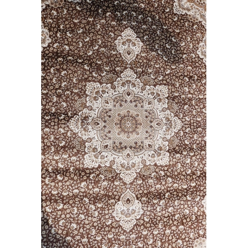 1085 - A Turkish brown ground thick pile carpet decorated with a floral medallion design and cream borders,... 