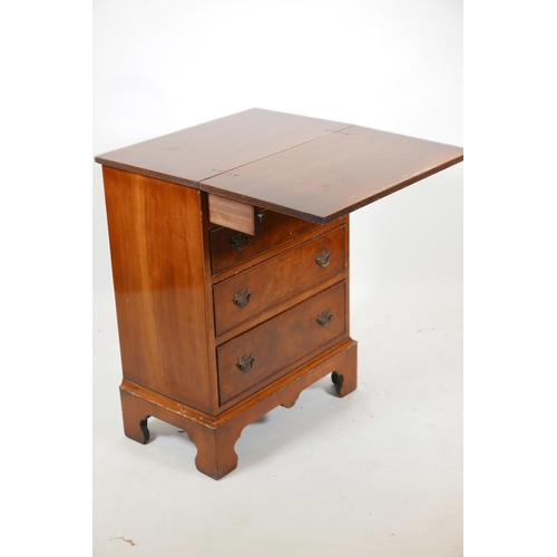 1088 - A walnut Reprodux bachelor's chest with four long drawers, raised on bracket feet, 23½