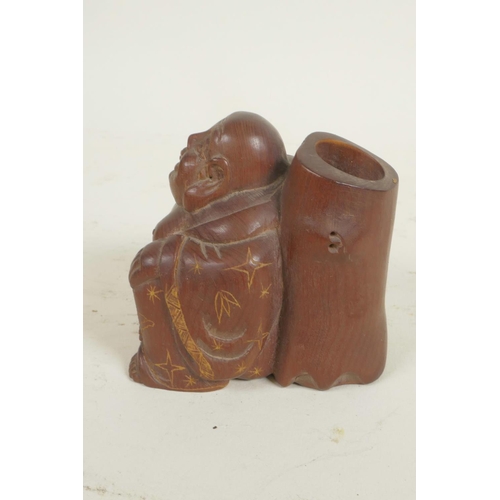 109 - A Japanese okimono carved as a jolly man with large sack, 2¼