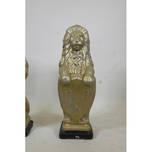 1090 - A pair of gilt moulded concrete garden lions, 31