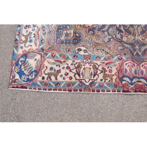 1092 - A vintage Persian Kashmar carpet decorated with a floral medallion on a purple ground, and a cream b... 