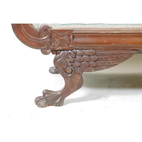 1101 - An American federal style mahogany two seat settee, with scrolled back and arms carved in the form o... 