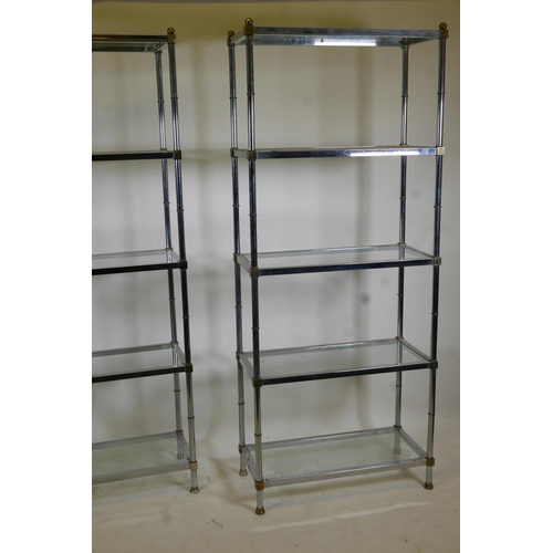 1108 - A pair of chrome and brass mounted five tier etageres/open shelves, with glass tops, 31