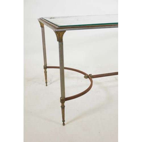 1120 - A chrome, steel and brass occasional table with reeded supports and shaped stretcher, 42