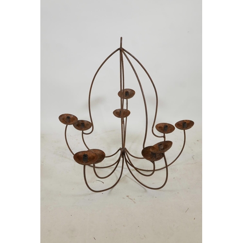 1128 - A wrought iron ten branch chandelier, A/F, 31½