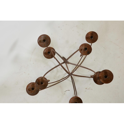 1128 - A wrought iron ten branch chandelier, A/F, 31½