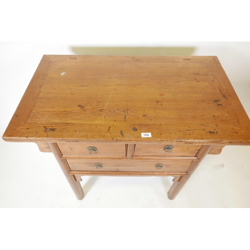 1129 - A Chinese elm side table with two short drawers over a single long drawer, 39½