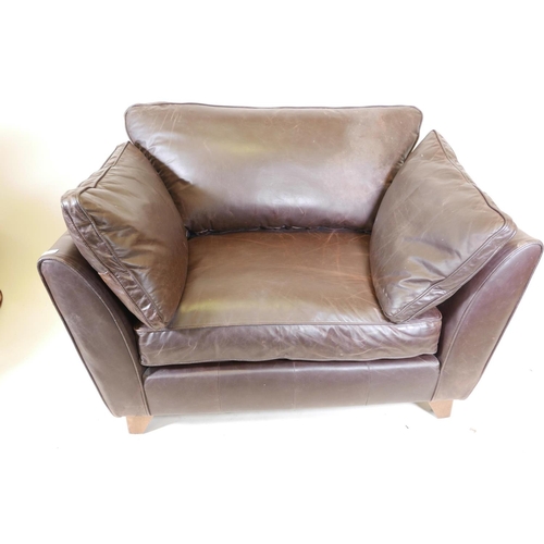 1150 - A Marks and Spencer brown leather armchair, 48