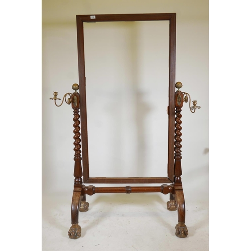 1196 - A C19th mahogany cheval mirror, with brass inlaid lining and gilt brass mounts and sconces, the mirr... 