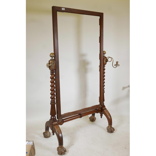 1196 - A C19th mahogany cheval mirror, with brass inlaid lining and gilt brass mounts and sconces, the mirr... 