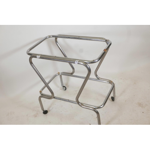 1205 - A vintage chrome plated tubular hostess trolley with roller castors, lacks glass tops, 28