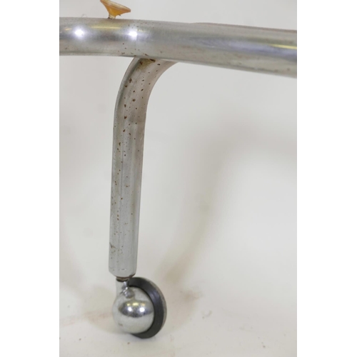 1205 - A vintage chrome plated tubular hostess trolley with roller castors, lacks glass tops, 28