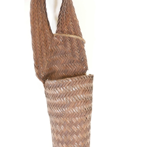 121 - A Nagaland long woven rattan basket, 59