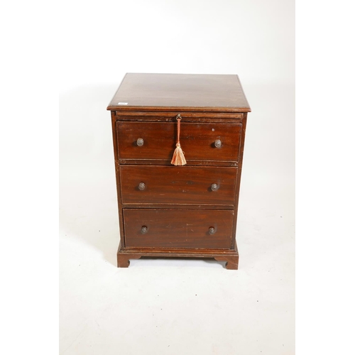 1221 - A mahogany three drawer chest with brushing slide on bracket feet, 34