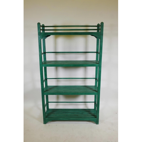 1223 - An Indian painted hardwood four tier open rack, 36