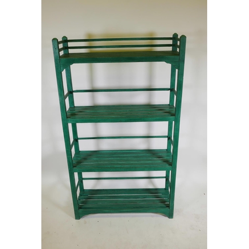 1223 - An Indian painted hardwood four tier open rack, 36