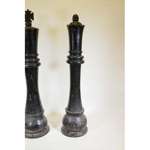 1224 - A pair of giant carved wood 'King and Queen' chess pieces, 72