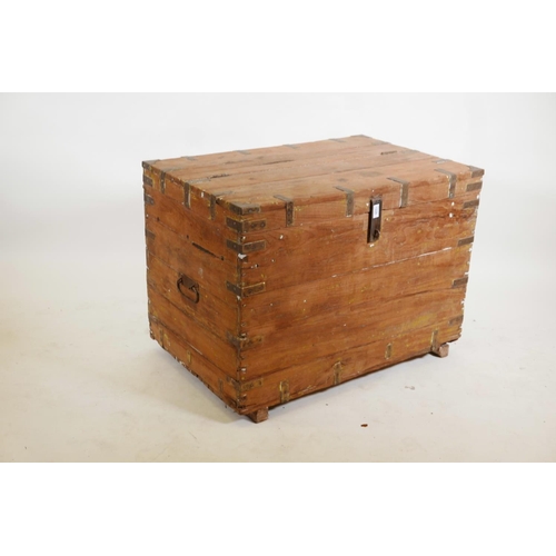 1226 - An Indian teak chest with brass mounts and hinged fold over top, 36