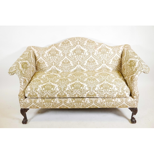 1229 - A Chippendale style two seater humpback settee with scroll arms, raised on carved cabriole supports ... 